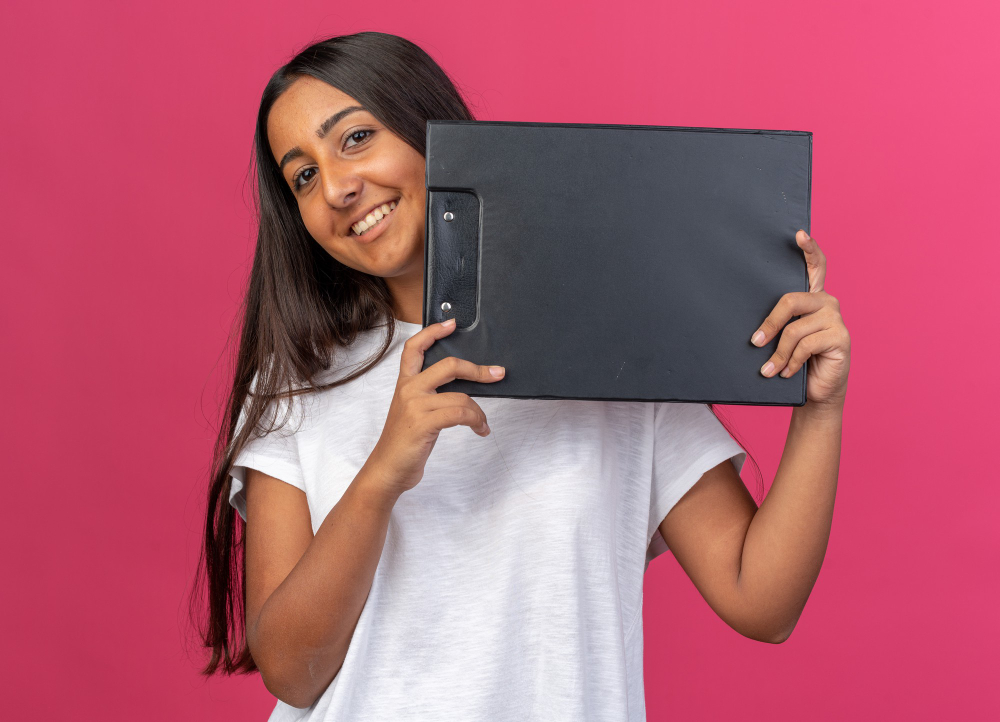 Smiling Girl Holding A Black Folder
